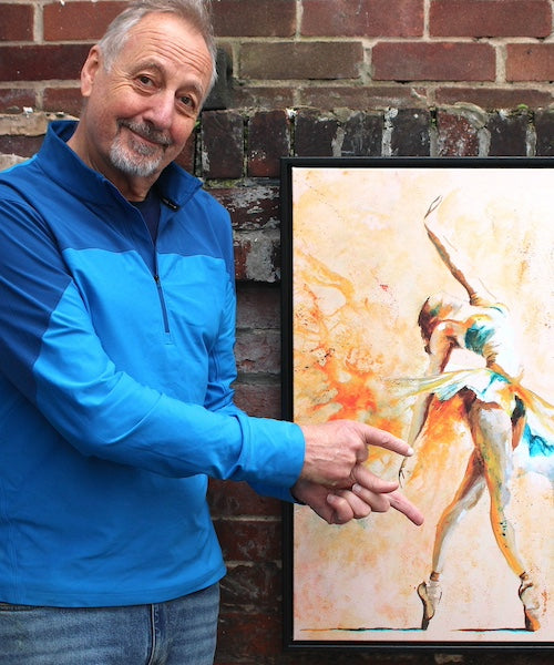 Derek Watkins in studio with a ballet painting